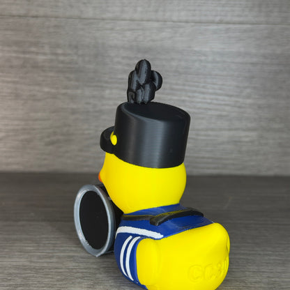 Back angle of the marching band duck showing the hat, plume, blue uniform and CC3D engraving on the back