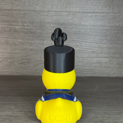 Straight-on back view of the drummer duck with black plumed hat, blue collar and CC3D engraved on the tail