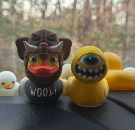 Wooli Duck and Subtronics Duck Sitting on car dash