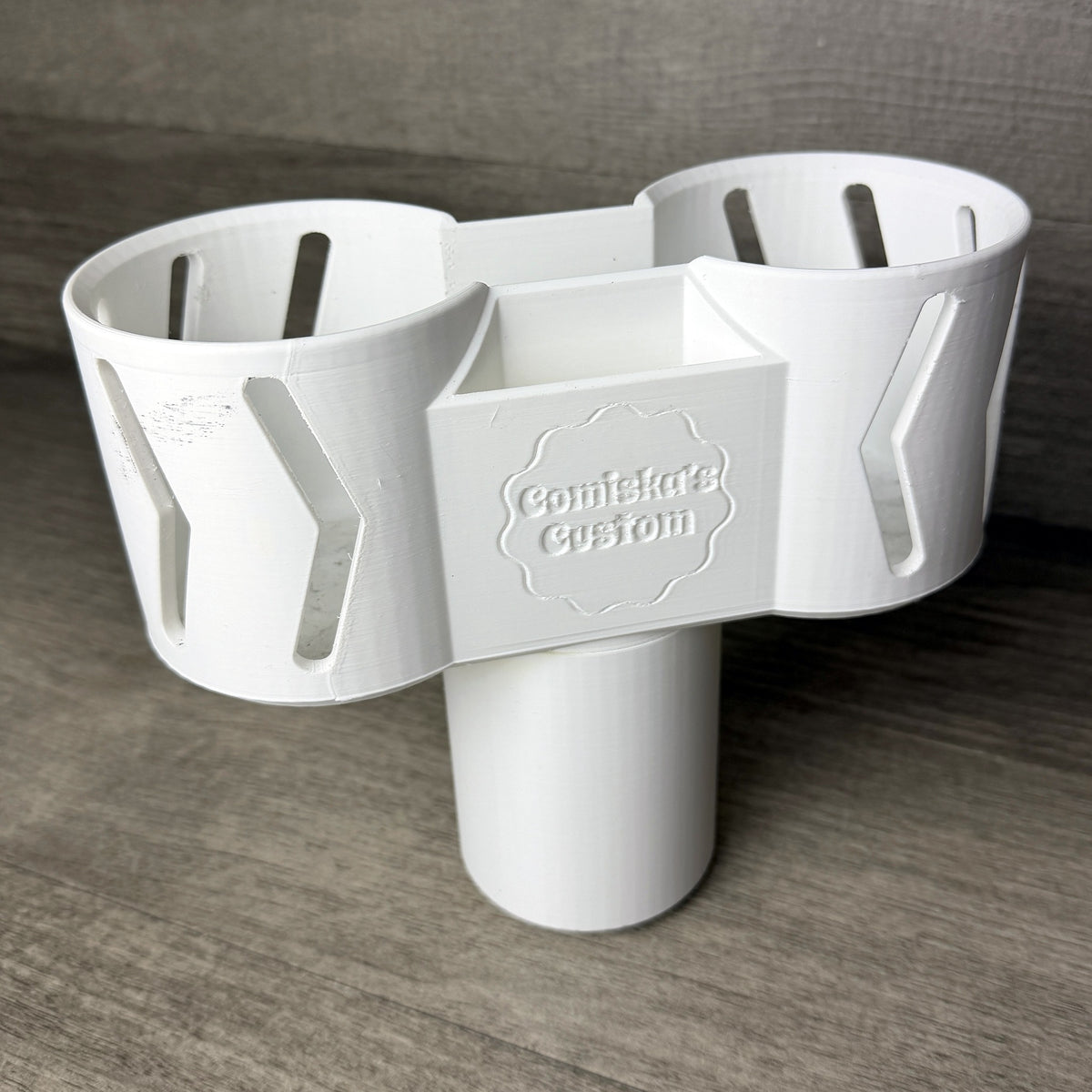White 3D printed dual cup holder expander with center storage pocket, angled view