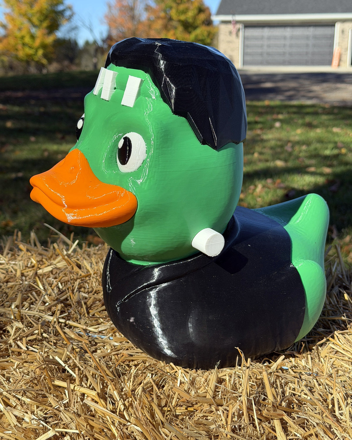 Giant Franken-Duck three-quarter view showing neck bolts and black jacket