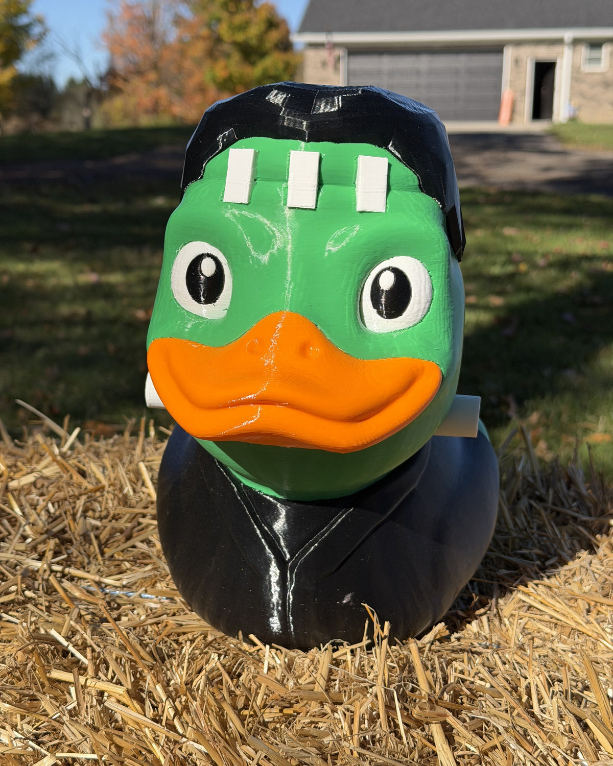 Giant Franken-Duck 3D printed Halloween decor on a hay bale