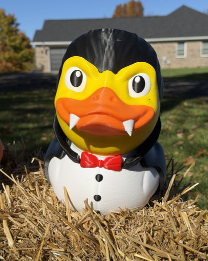 Giant Vampire Duck 3D printed Halloween decor on a hay bale