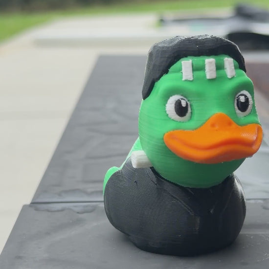 Franken-Duck figurine outdoors, slow turn around the duck