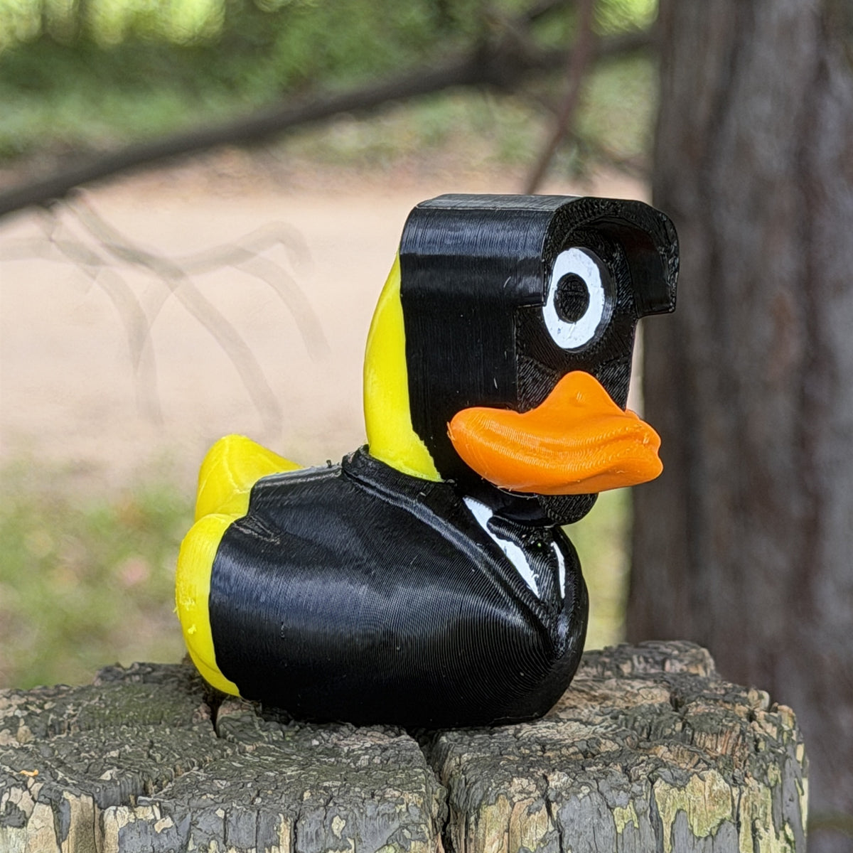 Spy Duck three-quarter view showing suit and yellow tail