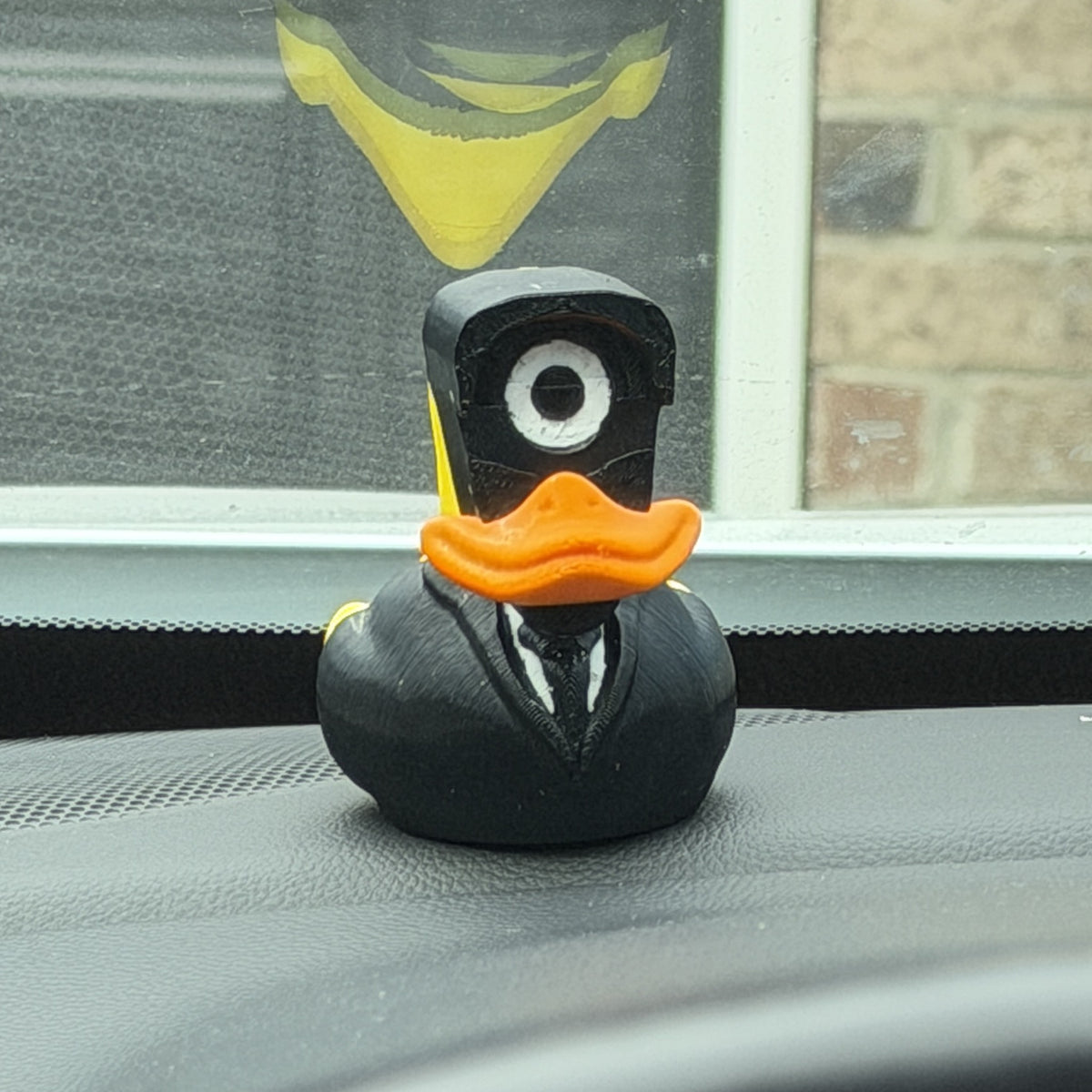 Spy Duck on a car dashboard