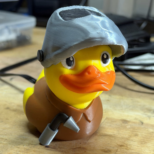 Welder Duck 3D printed duck with welding helmet and torch, brown work shirt